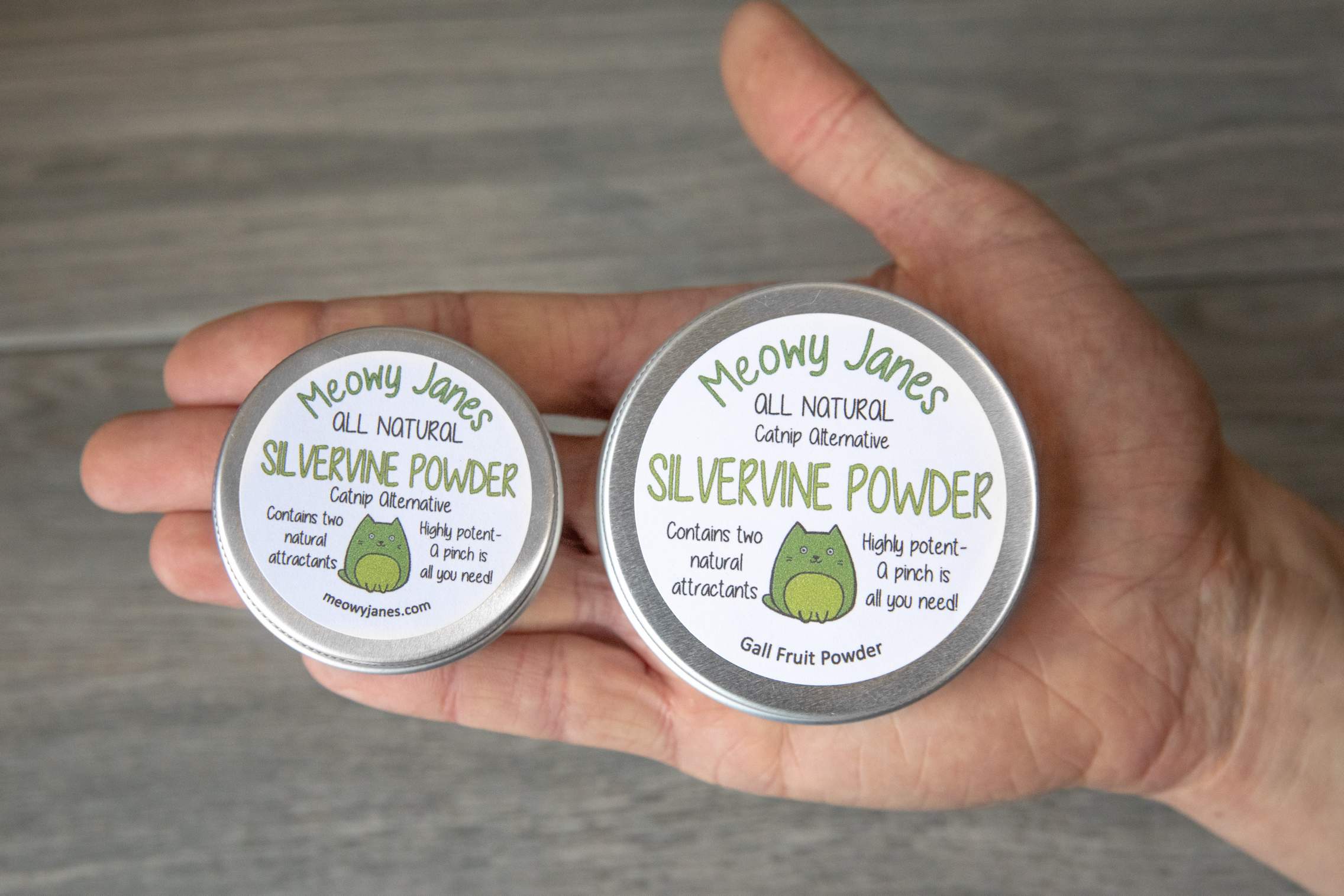 Two different size tins of silvervine powder