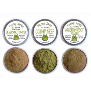 Three open tins of catnip, silvervine, and valerian root powder