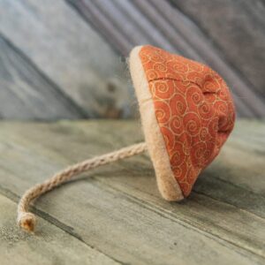 A cat toy that looks like an orange mushroom with jute stem