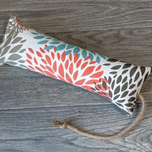 A catnip kicker made out of a fabric that looks like Chrysanthemum Flowers and Fireworks stuffed with catnip