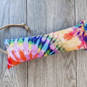A catnip kicker made out of a tye dye canvas fabric stuffed with catnip