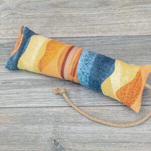 A catnip kicker made from a multicolor southwest themed fabric