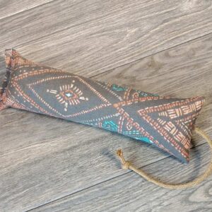 A catnip kicker made from a grey geometric aztec themed fabric. 