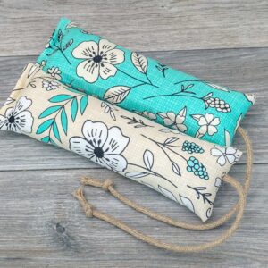 Two catnip kicker made from a fabric with a white and green modern pop art flower print