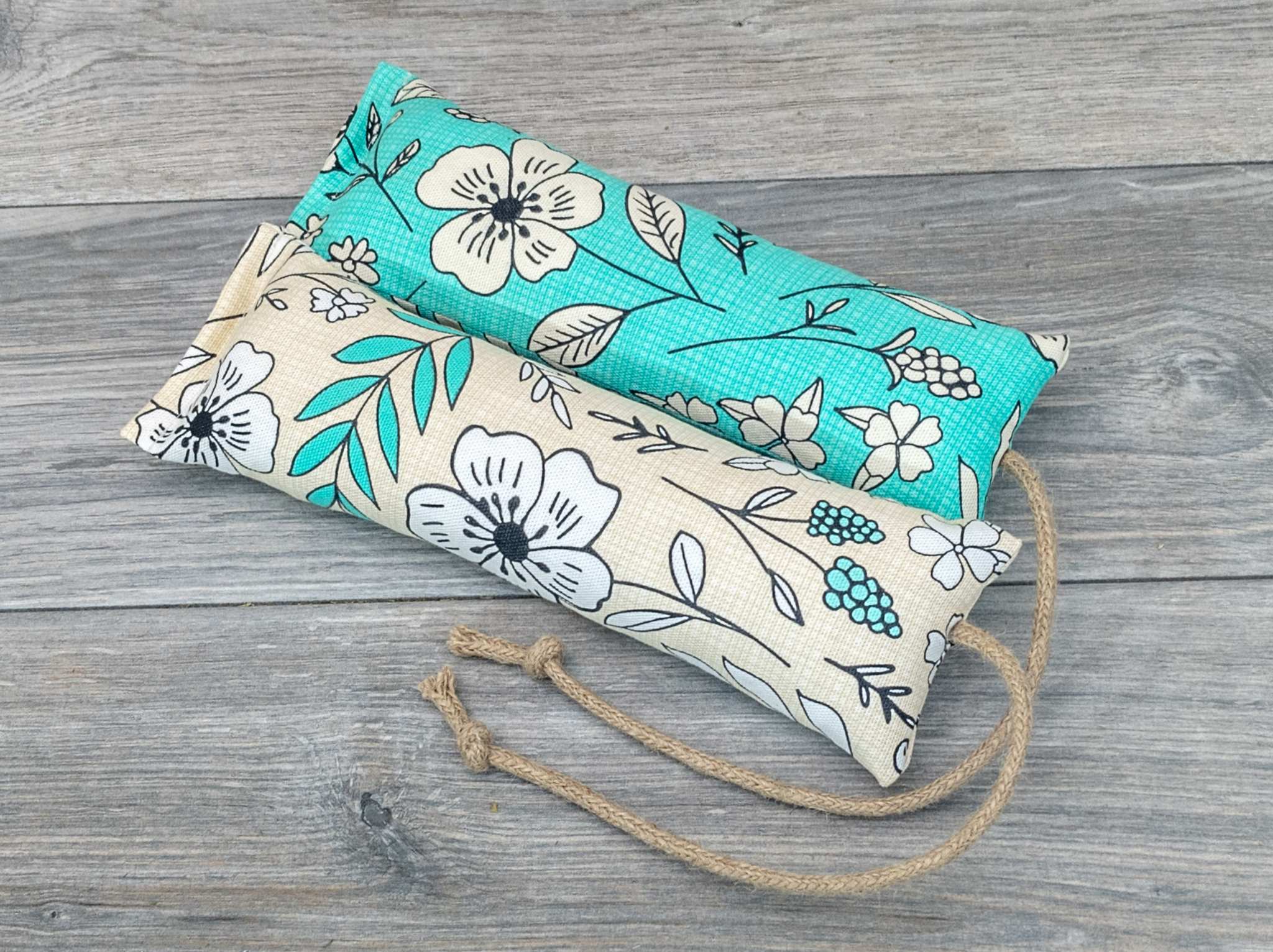 Two catnip kicker made from a fabric with a white and green modern pop art flower print