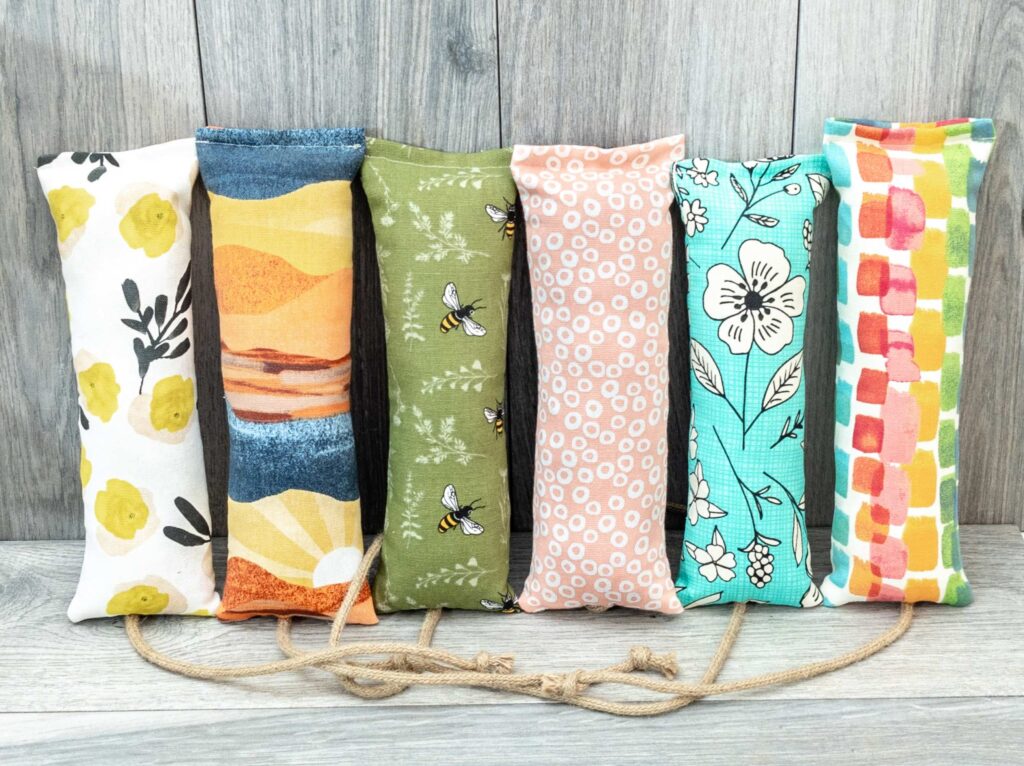 Catnip filled kicker cat toys standing in a row