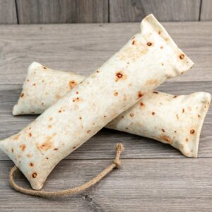 A refillable catnip kicker made from a fabric that looks like a burrito shell