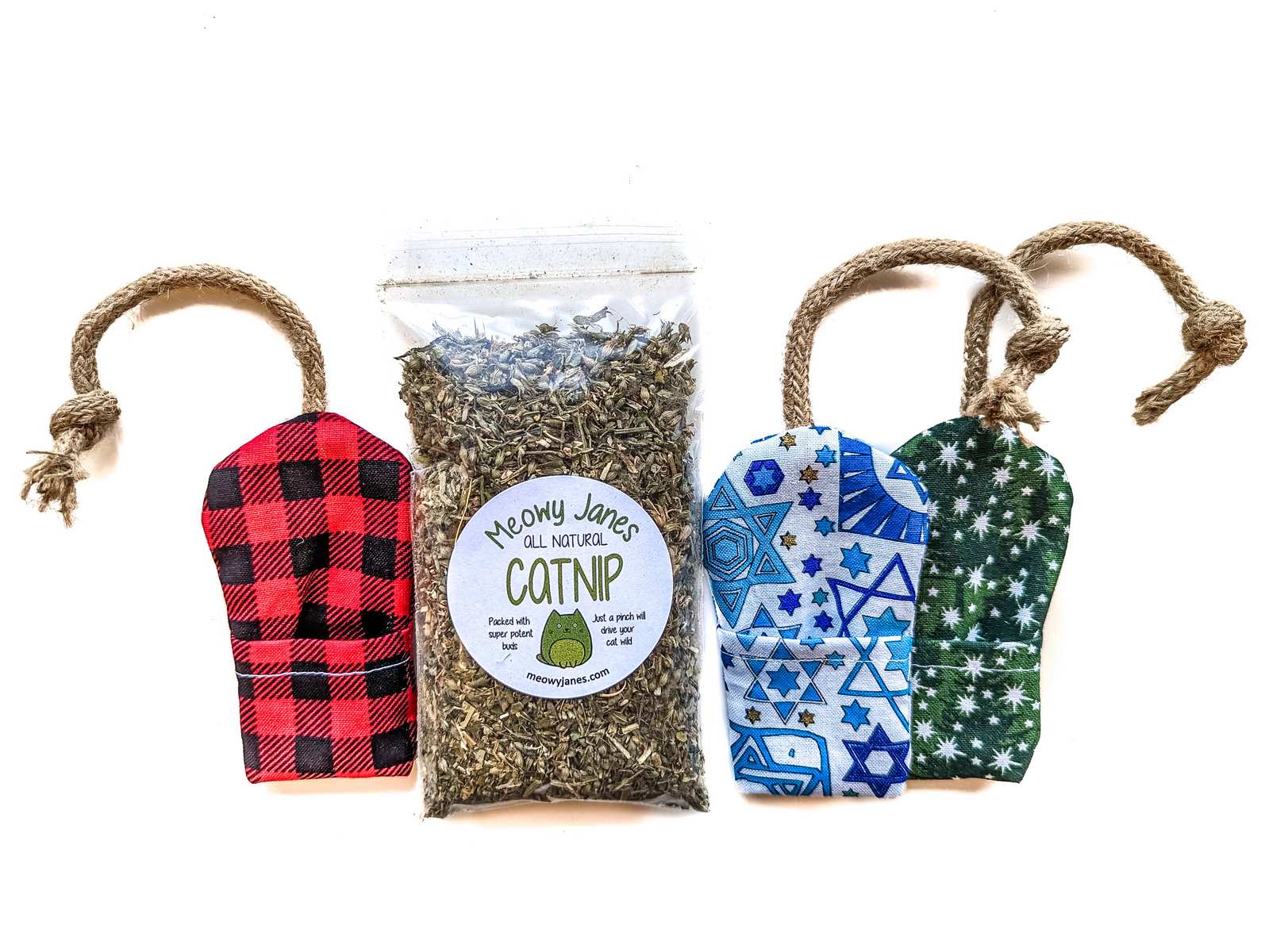 Fabric mouse toys in various holiday print fabrics with a bag of catnip