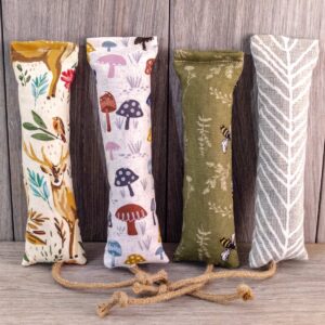 Multiple catnip kicker cat toys made out of a fabric with various prints