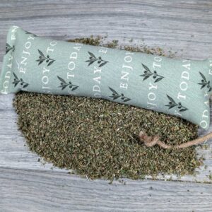 A catnip kicker made of fabric that says "Enjoy Today" on it.