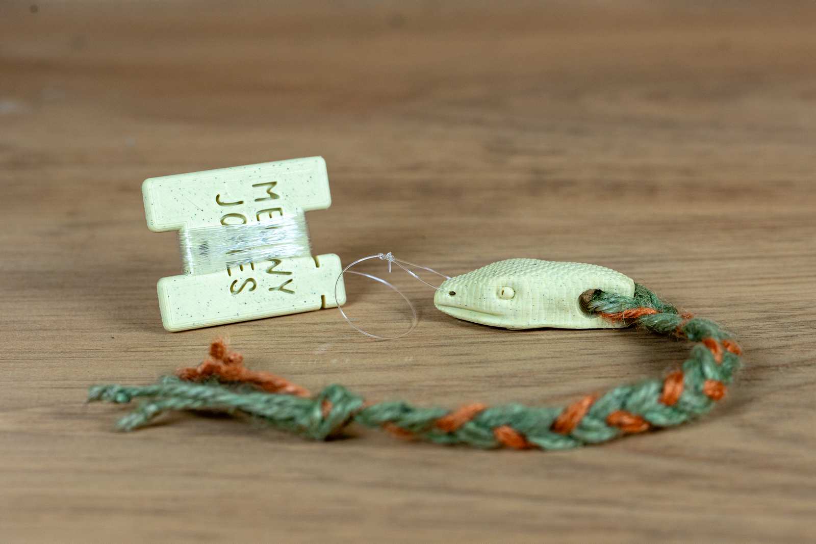 A 3D printed Snake toy for cats with various accessories.