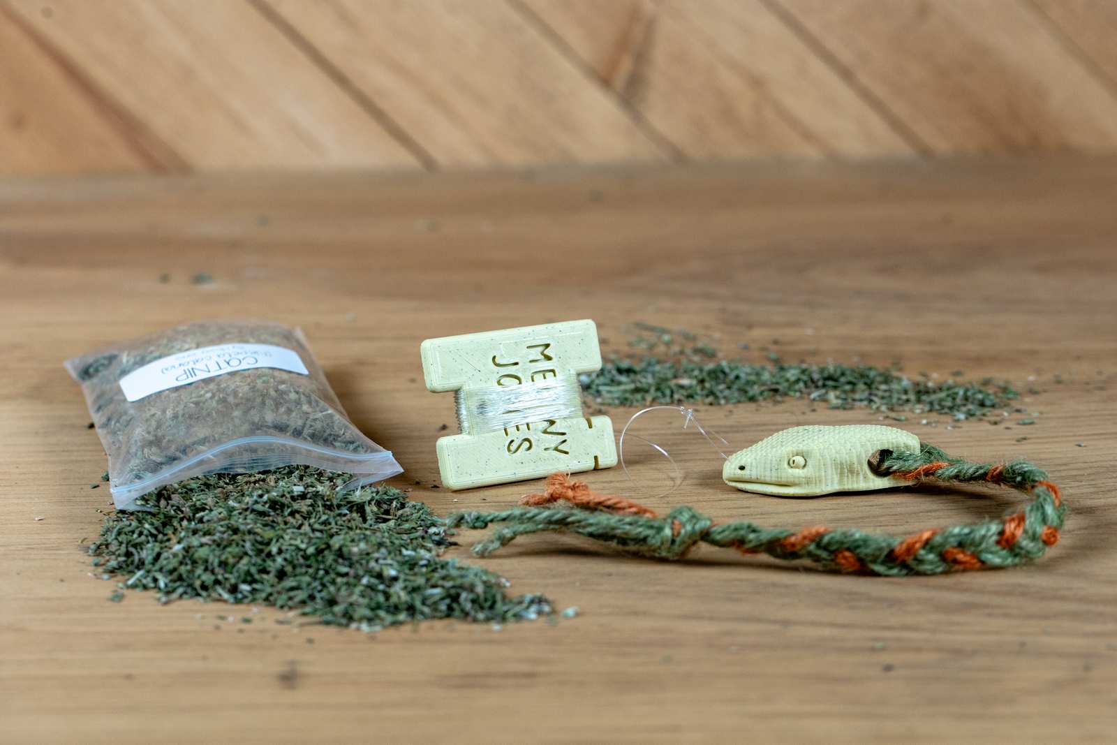 A 3D printed Snake toy for cats with various accessories.