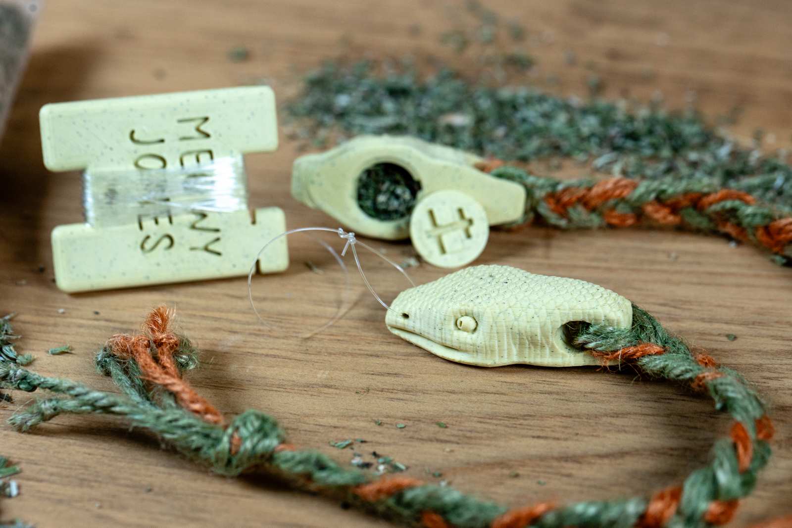 A 3D printed Snake toy for cats with various accessories.