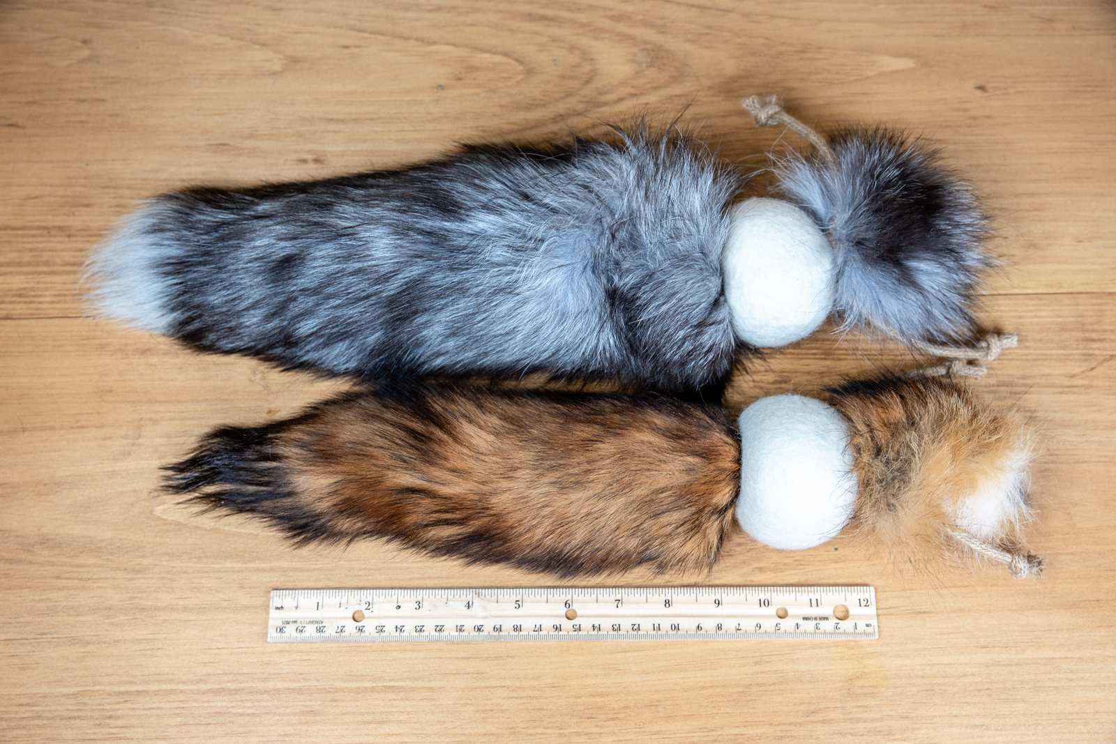 A ruler showing the size of the fox tail cat toys