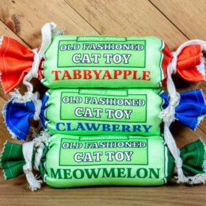 Three penny candy cat toys in different colors; blue, red and green