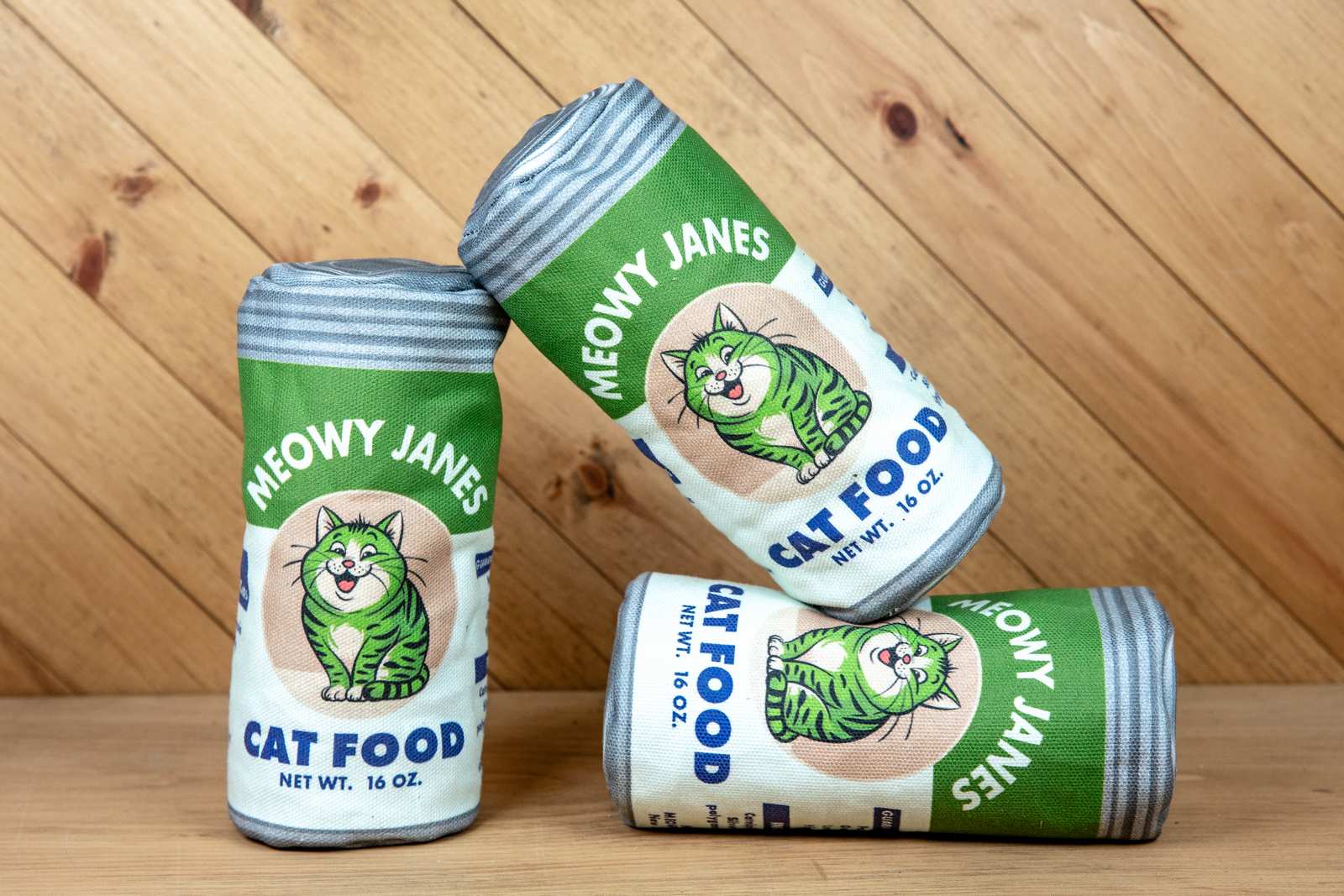 3 sewn toys that looks like a can of cat food stacked on top of each other